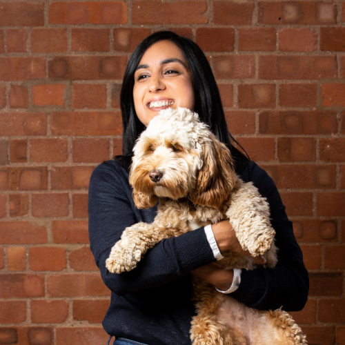 woman holding dog