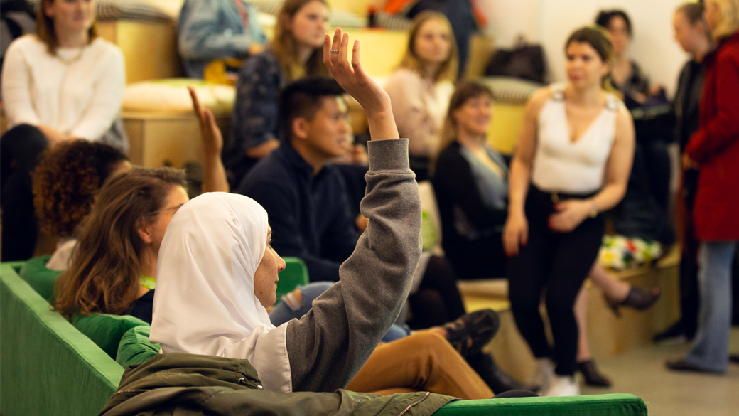 woman with raised hand