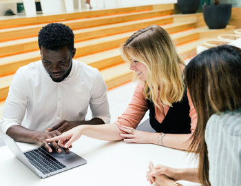 three people working together