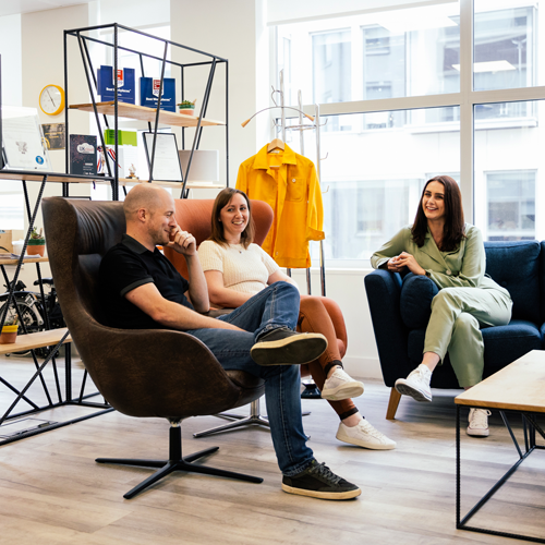 three people in a modern office