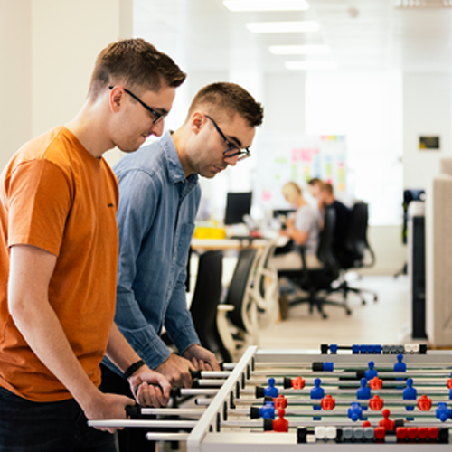 young people playing table football