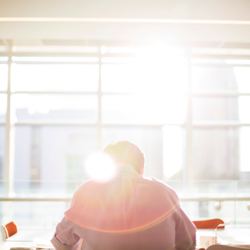 man working in bright office