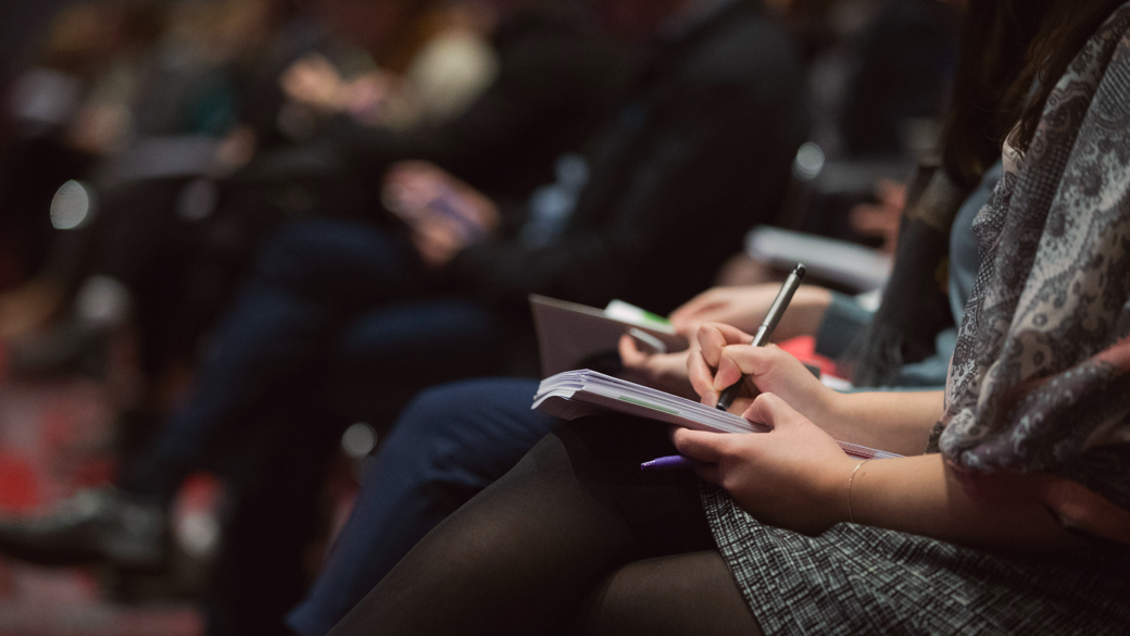 woman talking notes